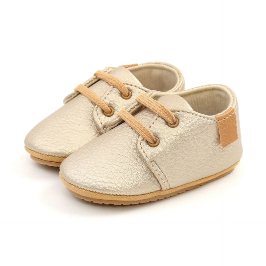 Image of Baby Retro Laced Sneakers in Gold from Baby Booties Boutique