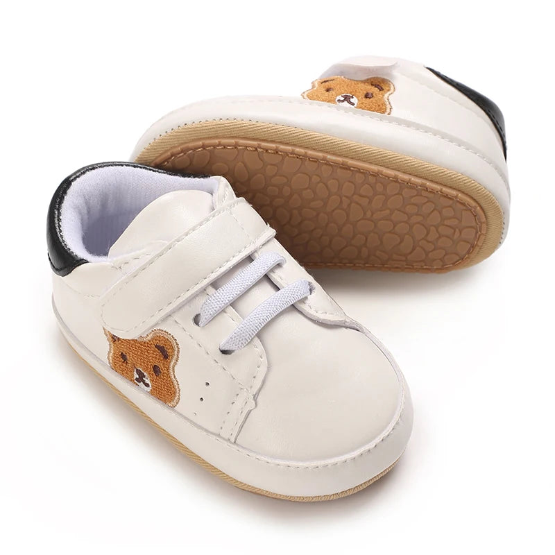 Image of velcro bear sneakers in white w/ black from Baby Booties Boutique