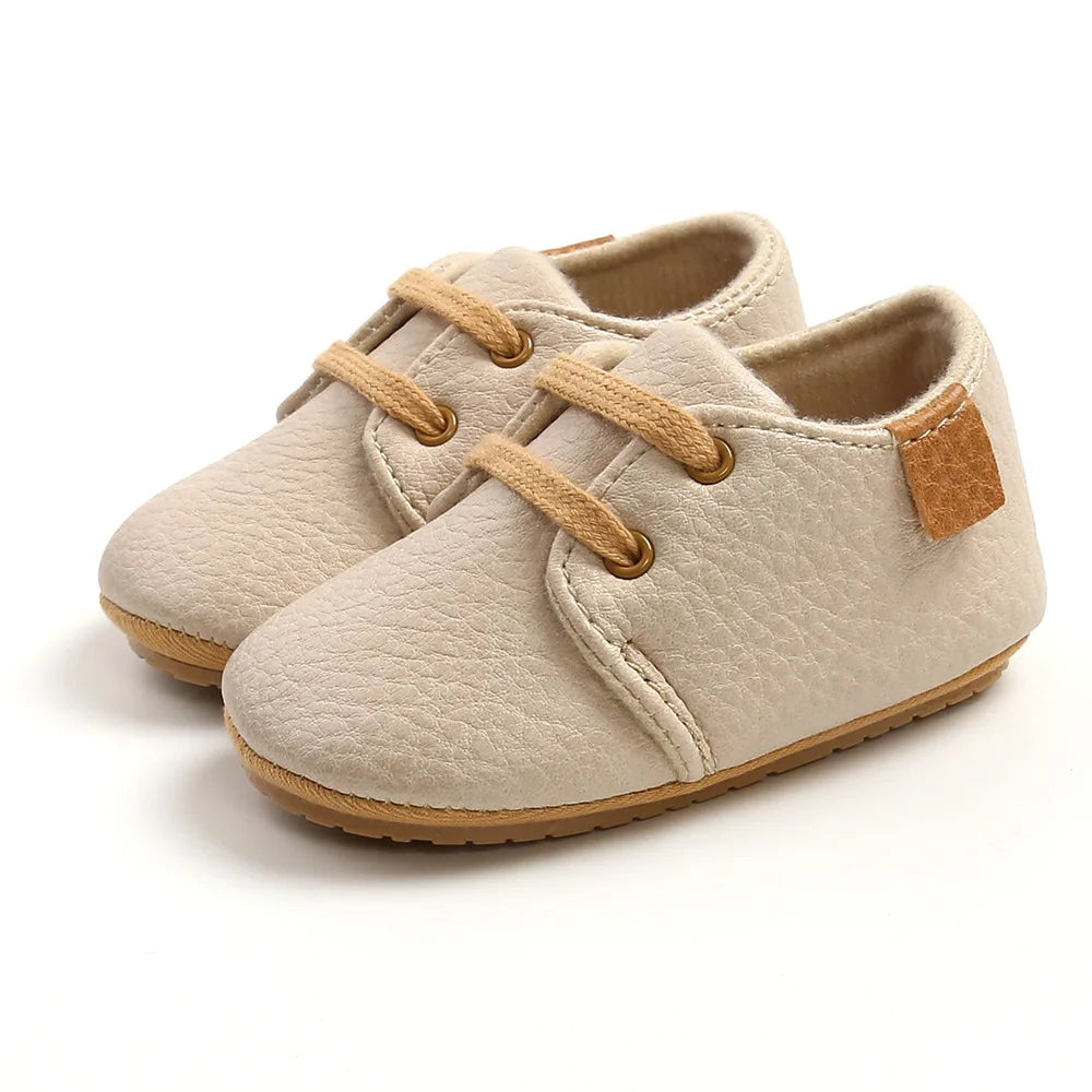 Image of Baby Retro Laced Sneakers in Beige from Baby Booties Boutique