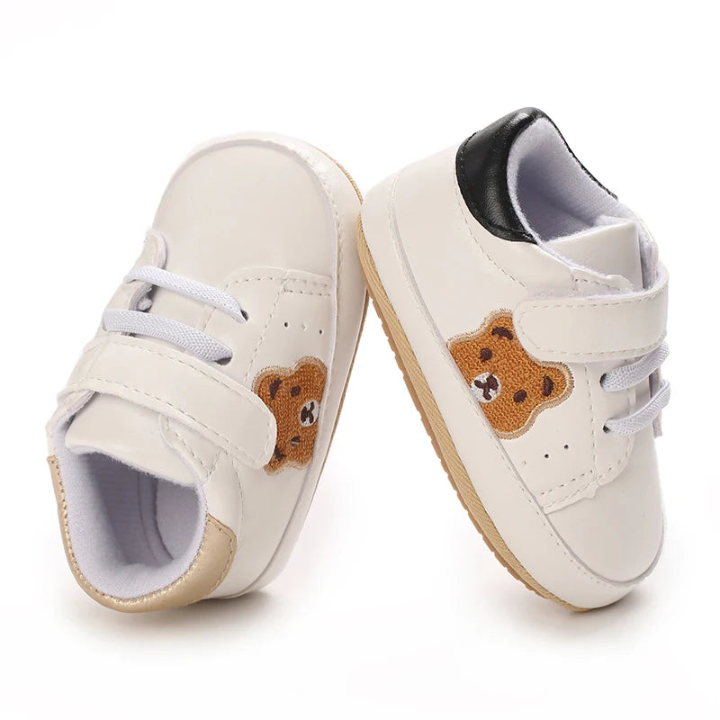 Image of velcro bear sneakers in white w/ black from Baby Booties Boutique