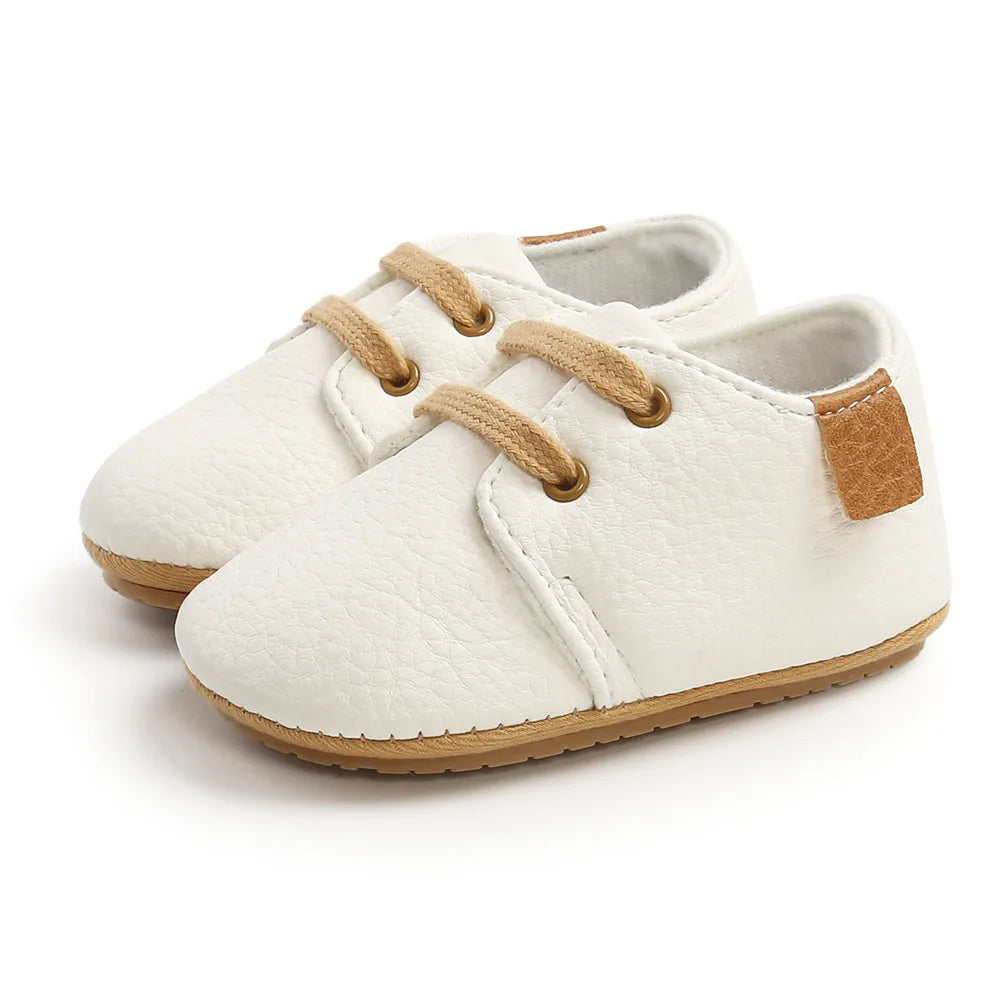 Image of Baby Retro Laced Sneakers in White from Baby Booties Boutique