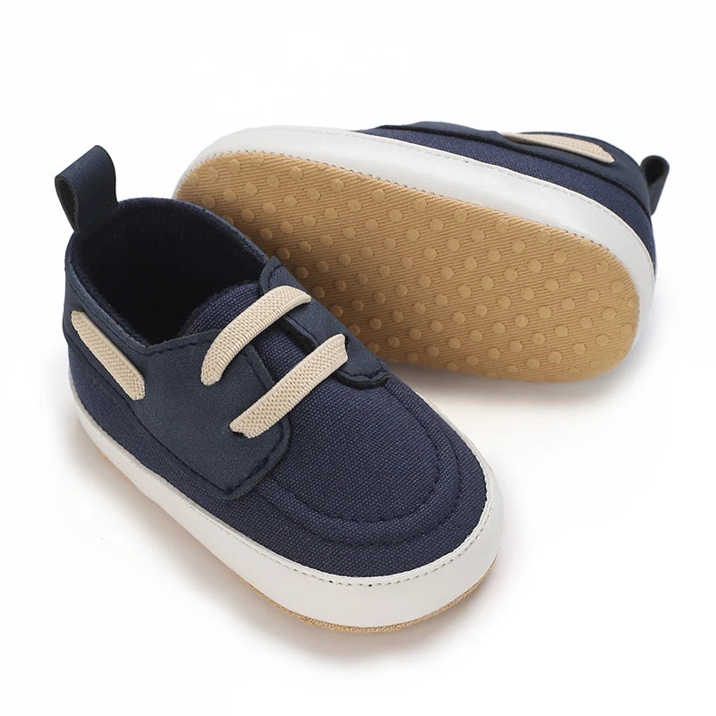 Image of infant boat shoes in navy from Baby Booties Boutique