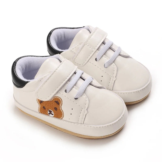 Image of velcro bear sneakers in white w/ black from Baby Booties Boutique